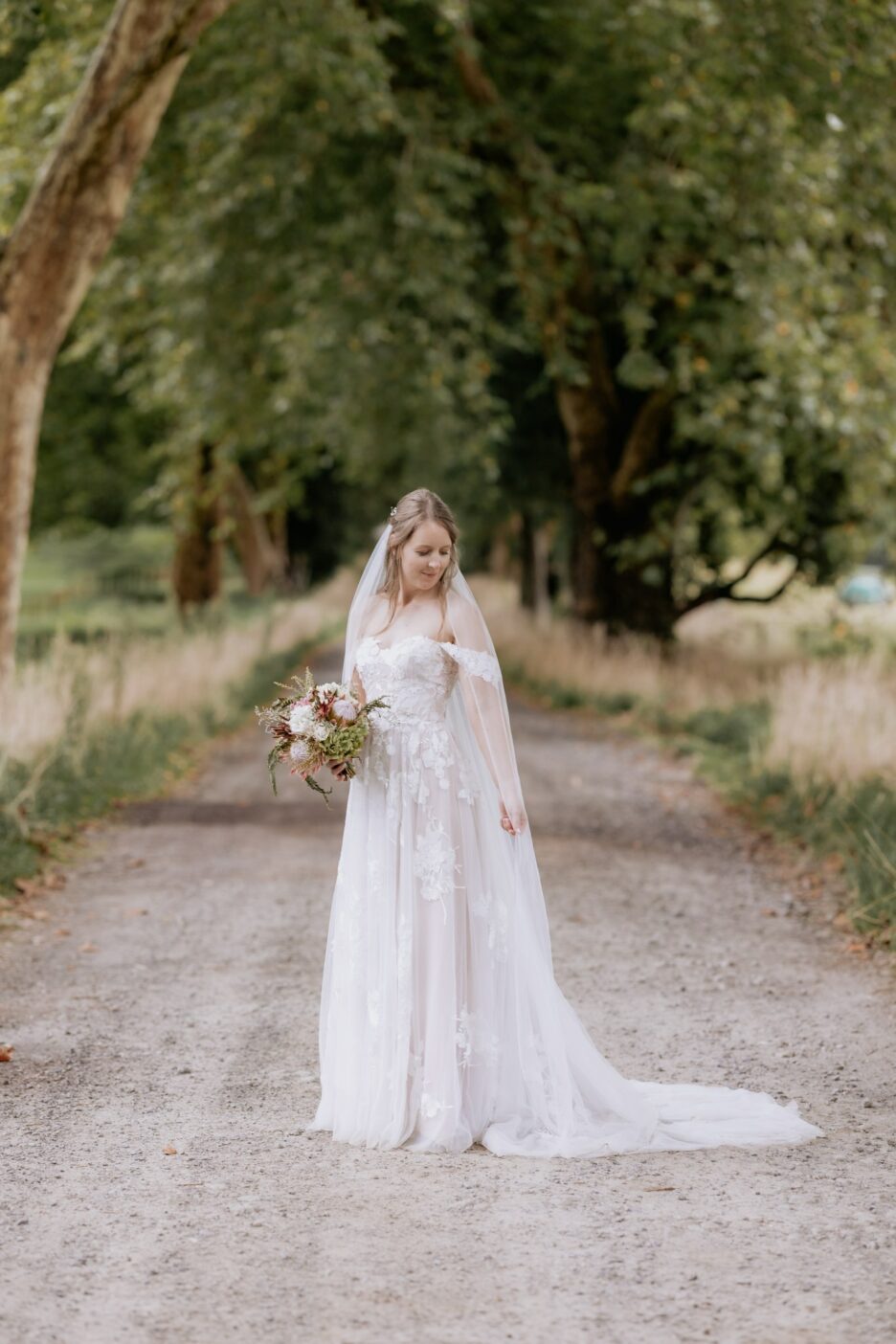 Bride showcasing her Madison rose wedding dress