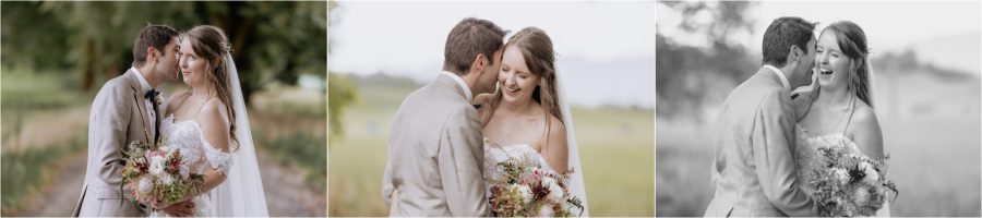 Bride and groom giggling cuddling during wedding photos