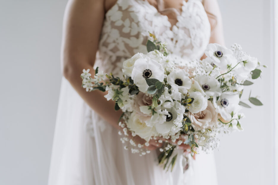 wedding bouquet held by bride in antique shades