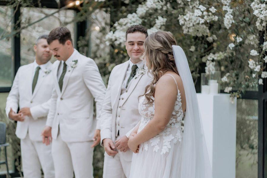 groom looks at bride during vows