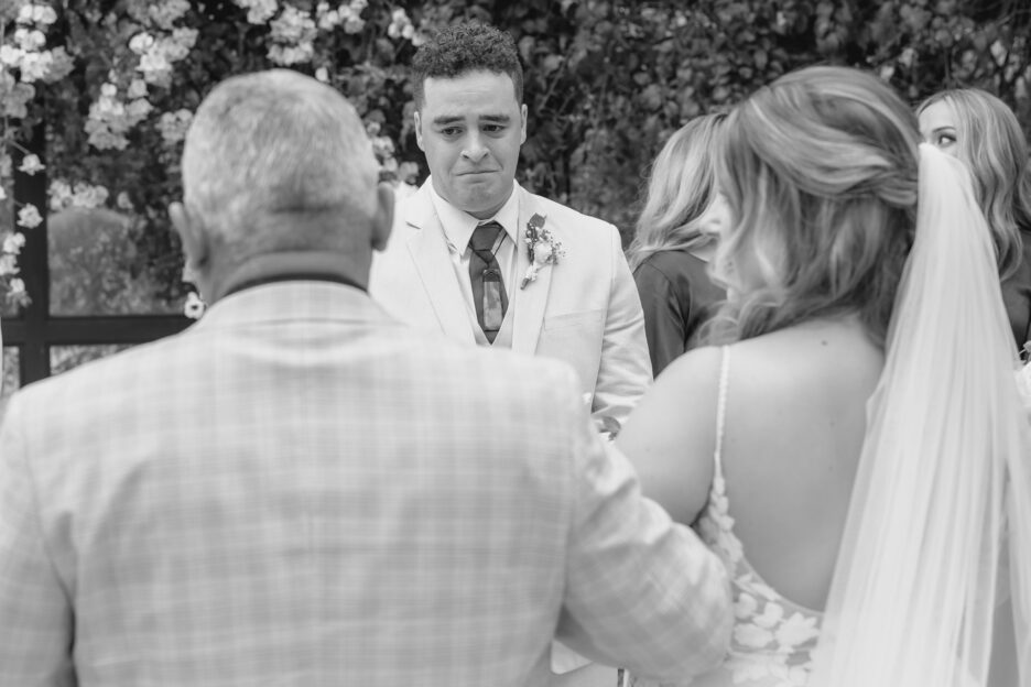 groom in tears as bride walks down aisle at Black Walnut Tauranga