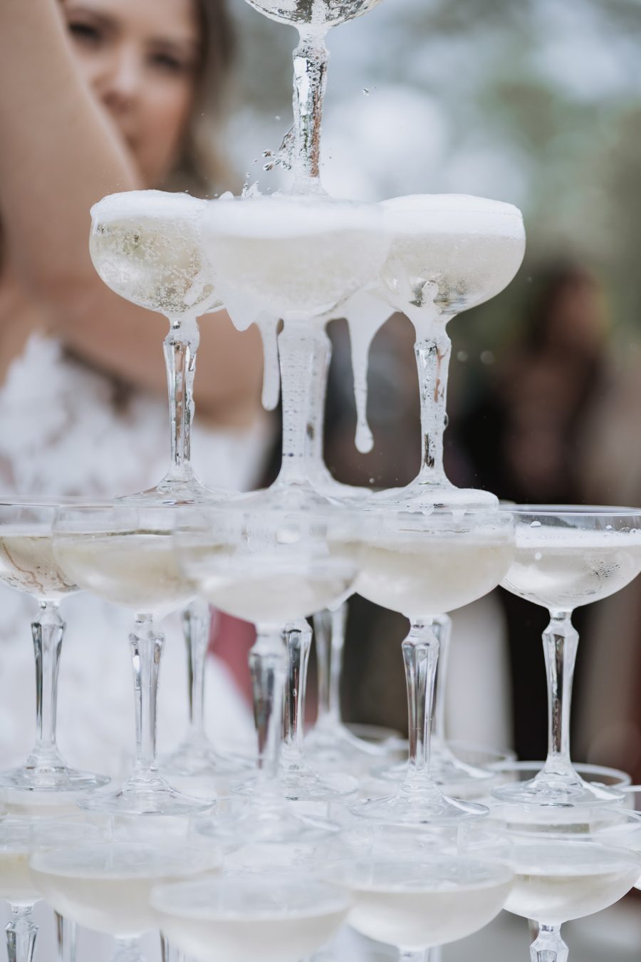 champagne glasses being filled