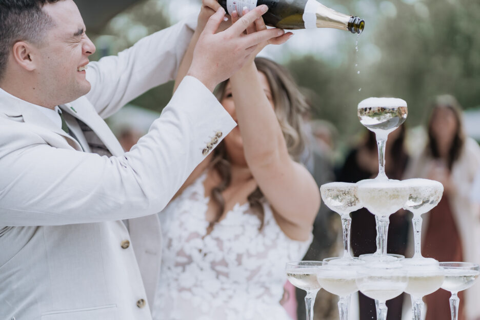 filling champagne glasses tower