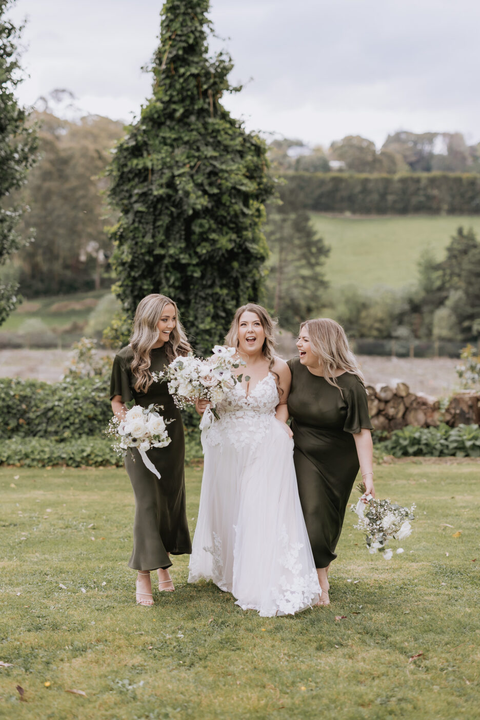 bride laughing with her bridesmaids at black walnut in tauranga