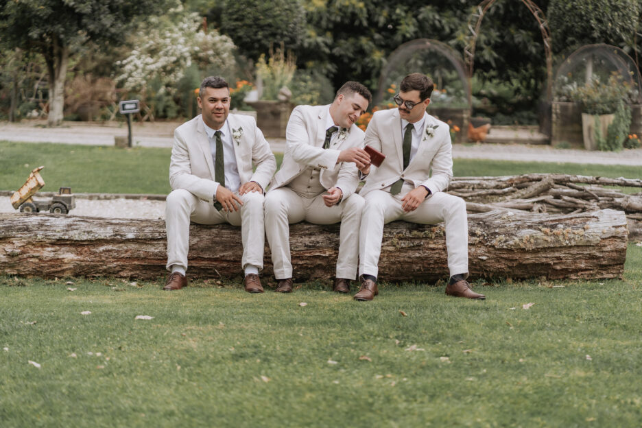 groom pouring a whiskey for his groomsmen