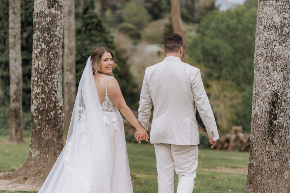 bride looking over shoulder at black walnut venue