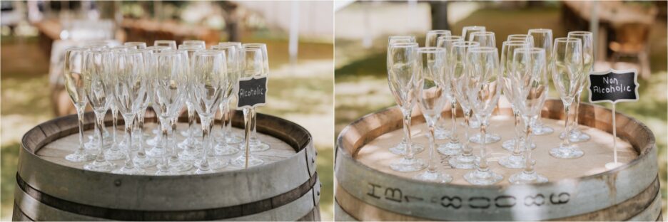 alcoholic and non alcoholic wine glasses on barrel