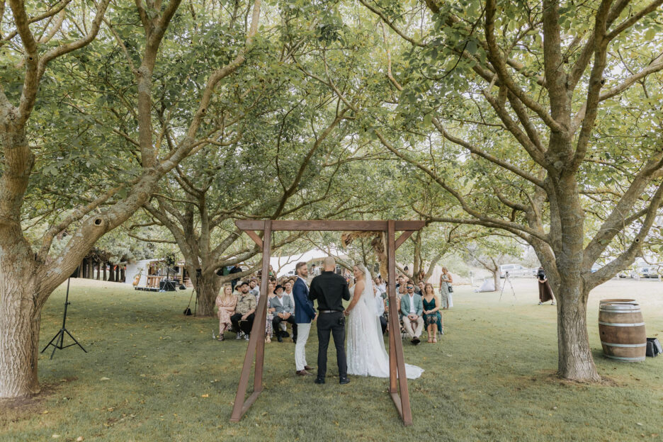 Looking back at ceremony under trees at Te tumu papamoa