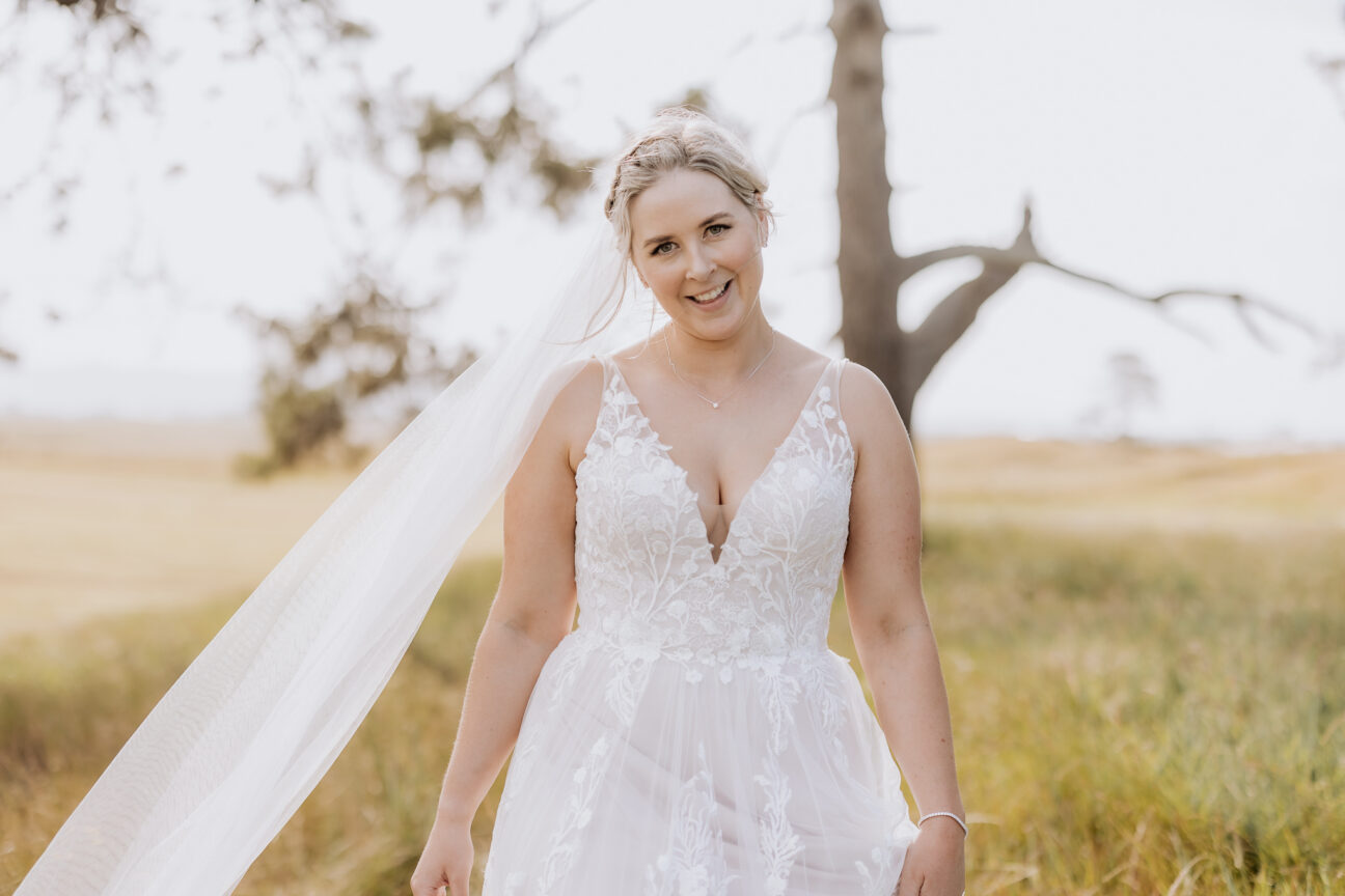 Bride smiling during photos Te Tumu Estate Papamoa