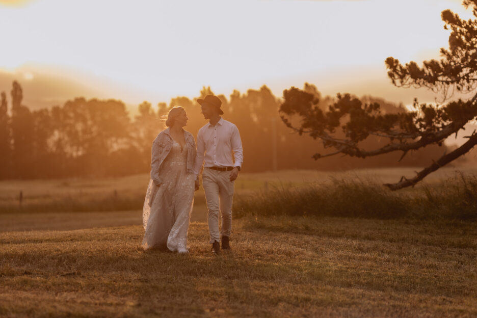 bride and groom walking at golden hour photography Pure images