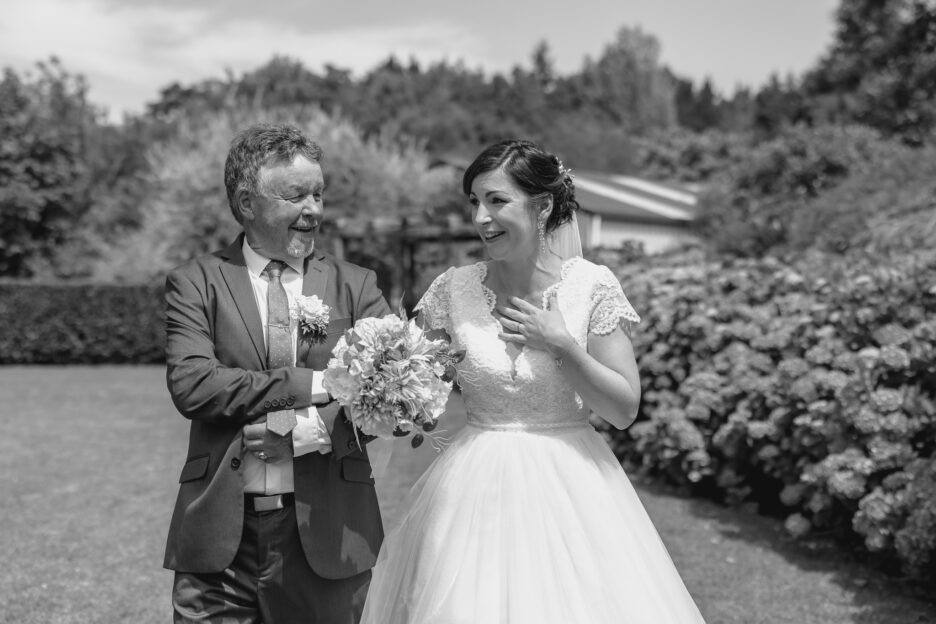 emotional bride walking down aisle