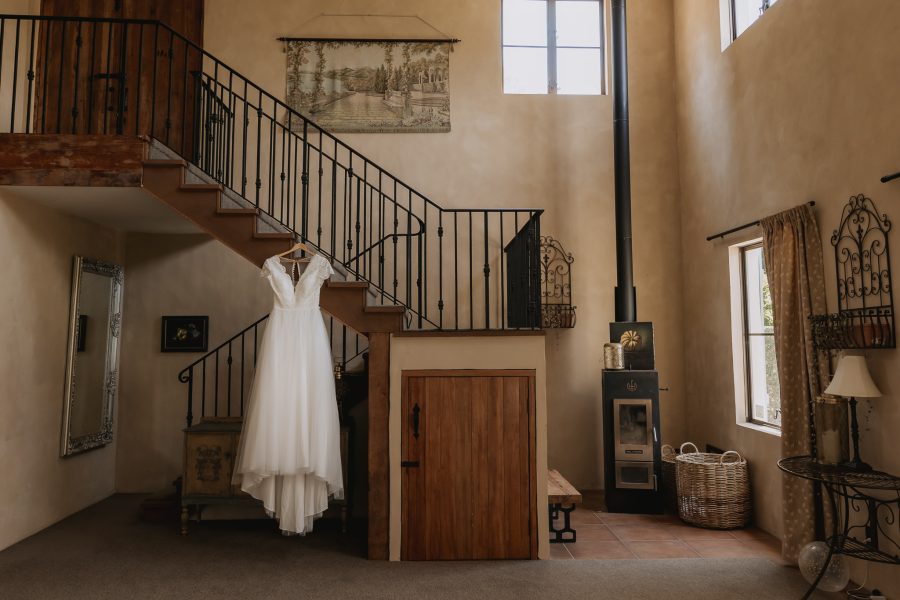 Wedding dress from JJ's house hanging in villa vie french country house