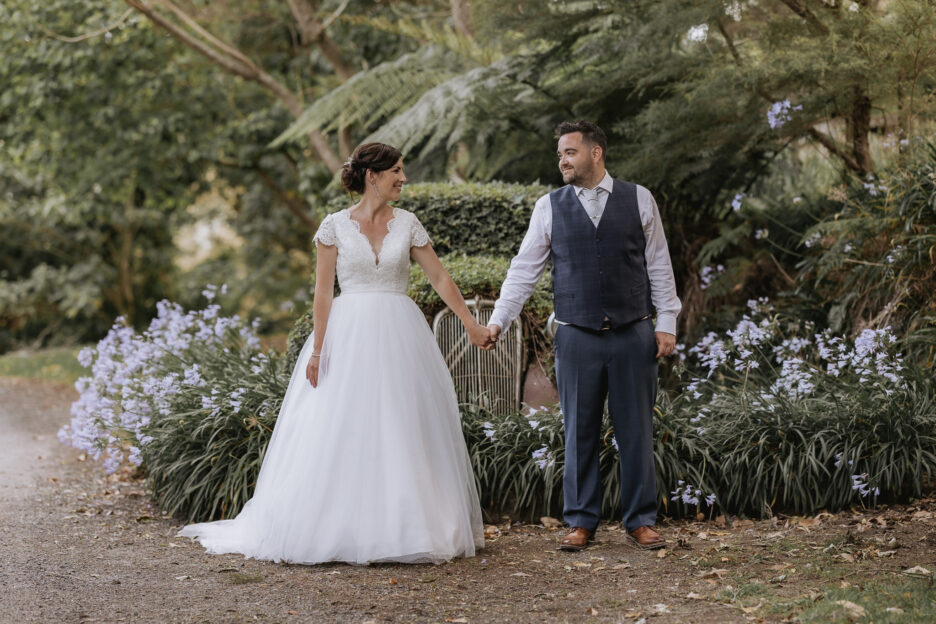 bride and groom standing by citroen in drive of Villa Vie