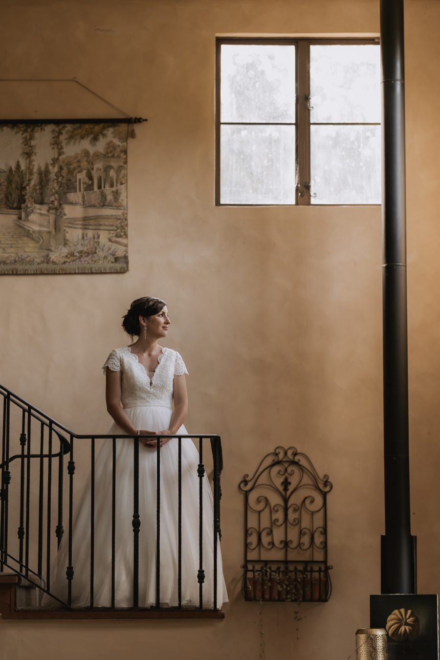 Bride on stair case french villa vie