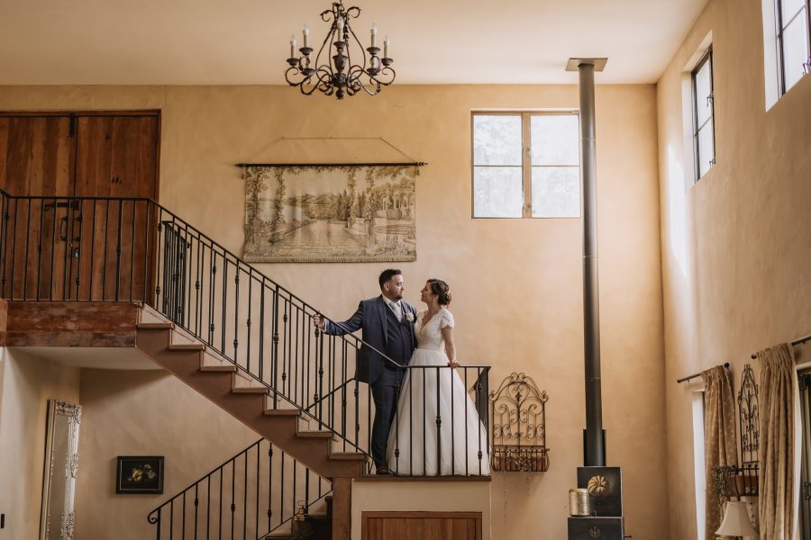 Wedding photo on stairs of Villa Vies french country house