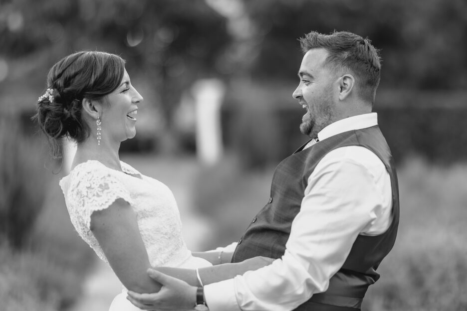 Bride and groom laughing together