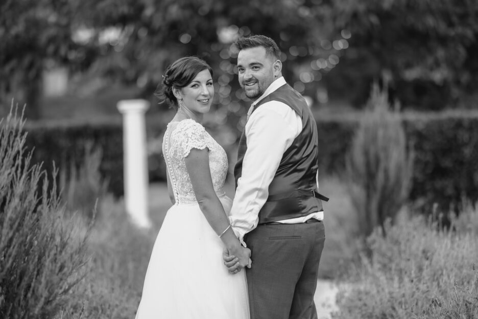 wedding couple turning around at Villa Vie holding hands