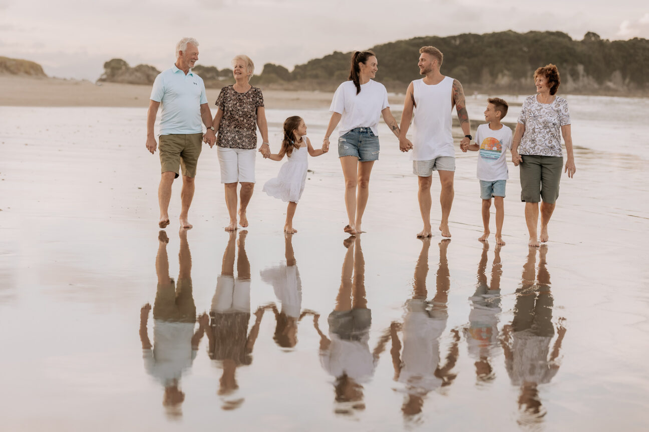 family in neutral tones on Mount Maunganui photo shoot