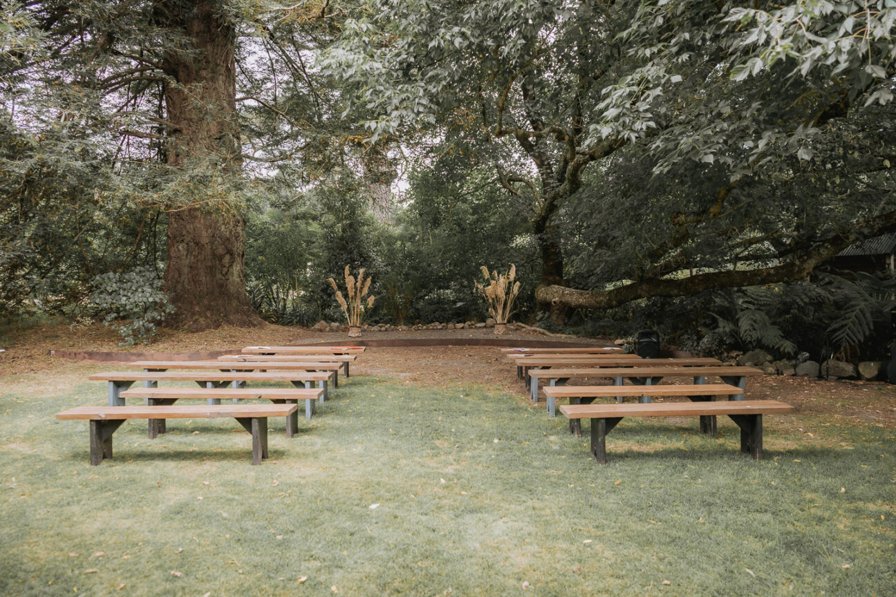 wedding area old forest school bench seats with toi toi