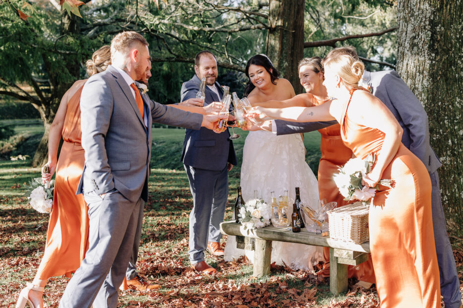 wedding party congratulates cheering glasses of champagne waterlily gardens