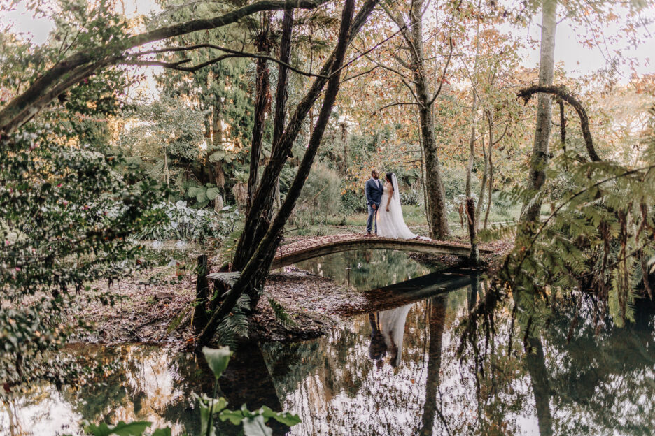 landscape wedding image in autumn garden on bridge waterlily gardens