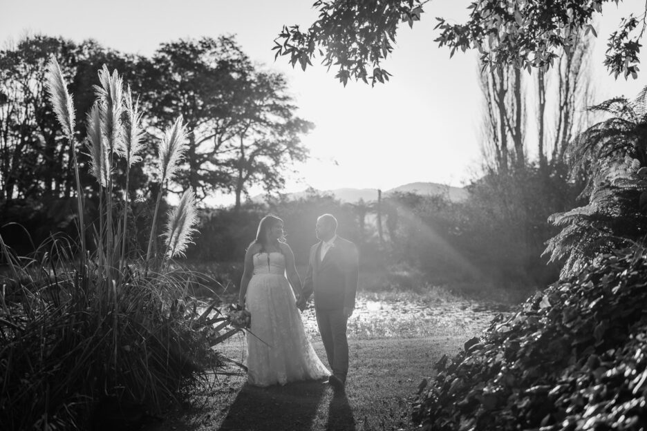 wedding couple walking at sunset waterlily gardens