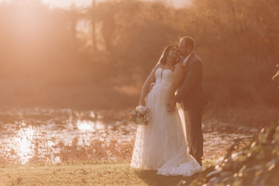 Wedding photos at golden hour in waihi's waterlily garden wedding venue