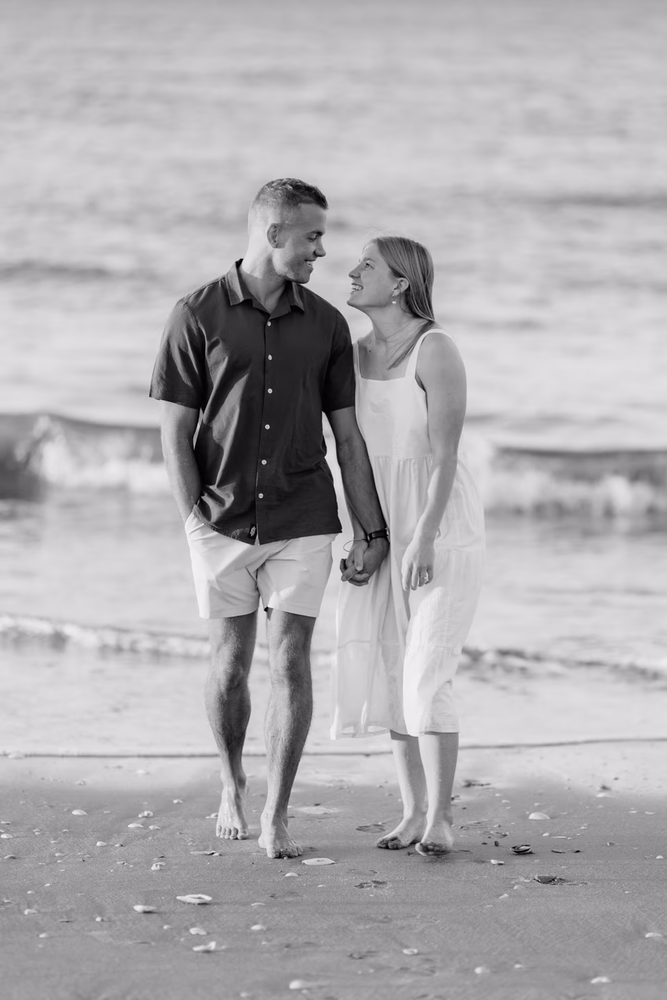 Black and white photo engagement shoot looking laughing
