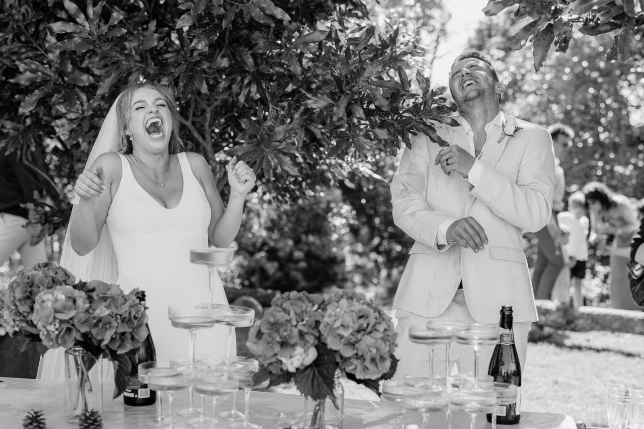 laughing bride and groom