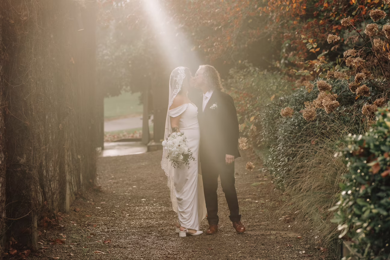 golden light on wedding couple ataahua autumn garden