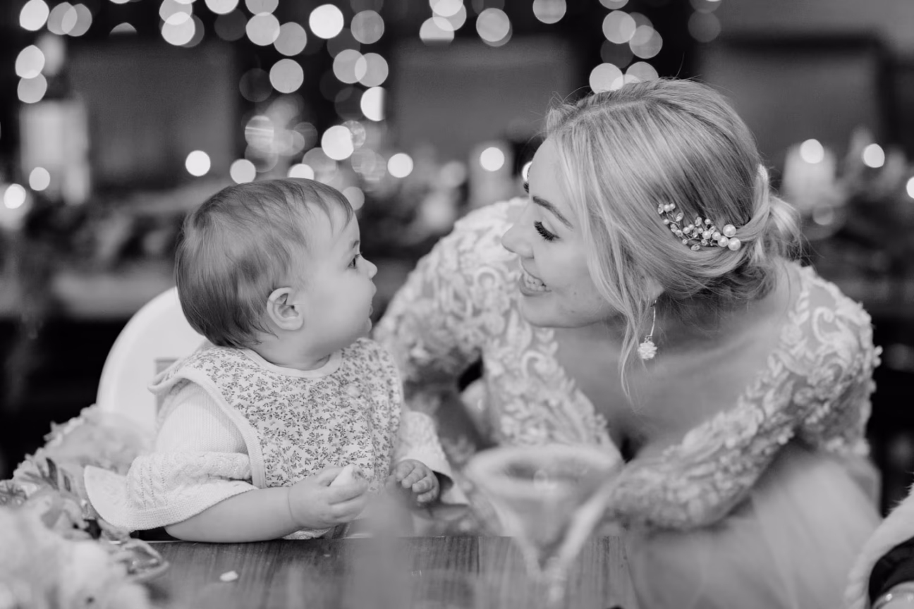 bride and baby sweet moment looking at each other